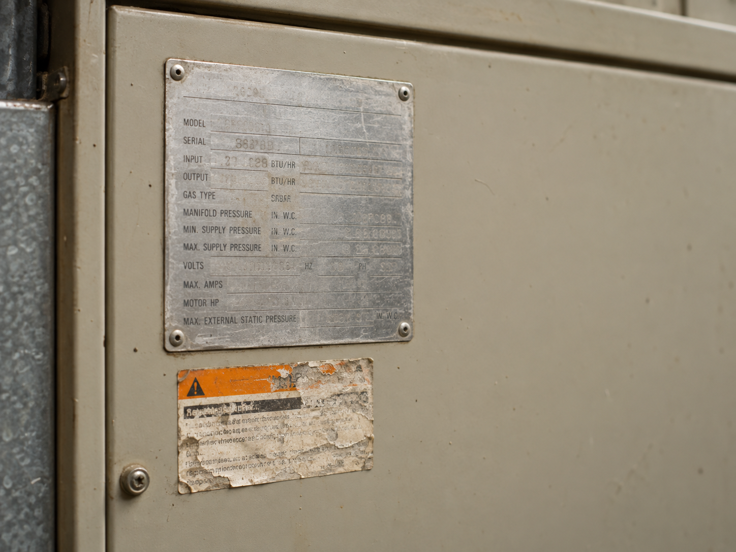 Worn equipment model plate and service label